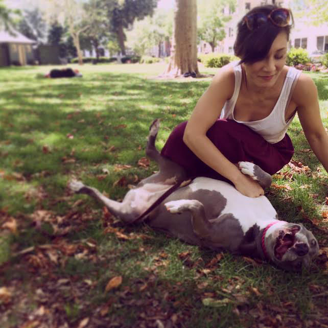 Sara Britt Playing With Dog