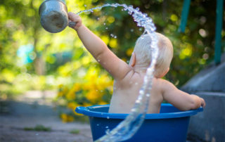 Infant in Tub Playing